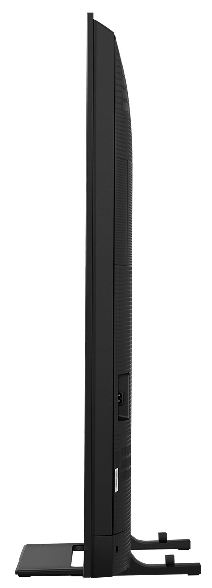 Widok z boku czarnego telewizora na białym tle. Telewizor stoi pionowo ze stojakiem. Zawiera port zasilania.