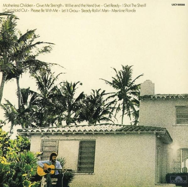 Albumcover mit einem Mann, der Gitarre spielt. Palmen und Himmel im Hintergrund. Albumtitel oben.
