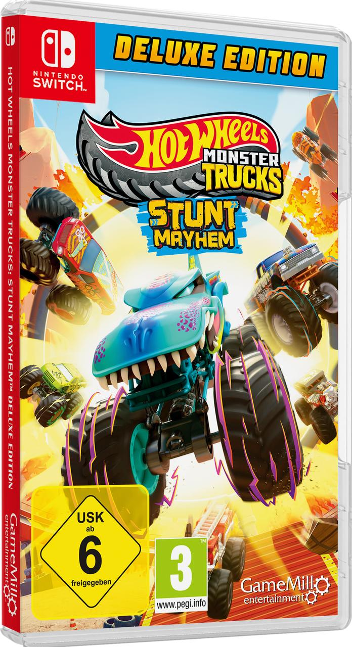 Videospiel-Box mit Hot Wheels Monster Trucks. Ein Monstertruck mit Dinosaurierkopf steht im Zentrum, umgeben von weiteren Trucks.