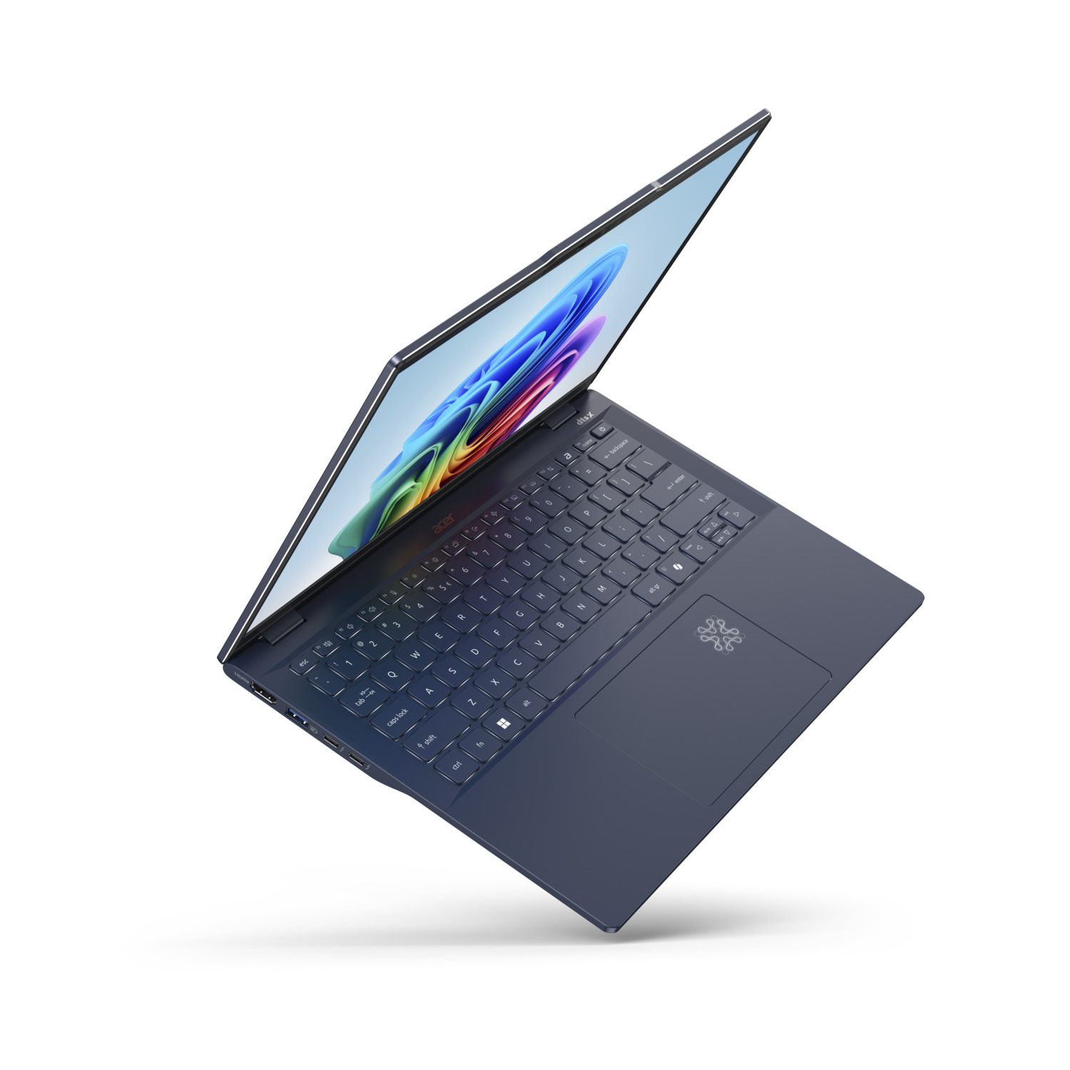 A blue Acer laptop is open, displaying a colorful abstract image on the screen. The keyboard and touchpad are visible.