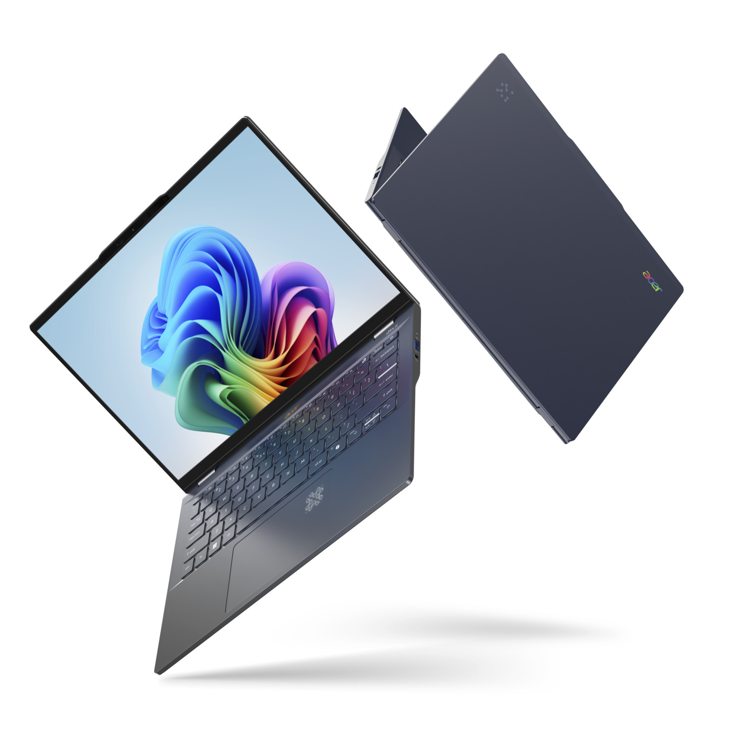 A dark blue Acer laptop is open, showing a colorful abstract image. Another closed laptop is beside it, both floating.