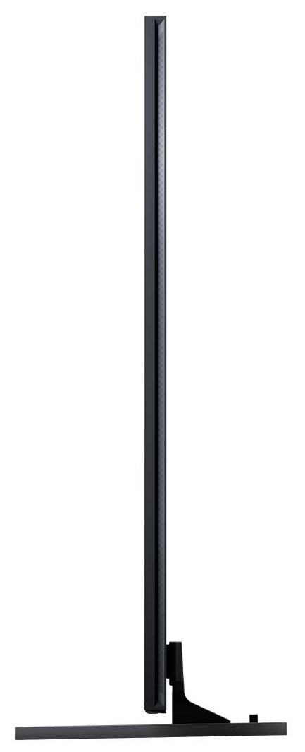 Czarny, smukły ekran telewizora widać z boku. Ma podstawę i jest na białym tle.
