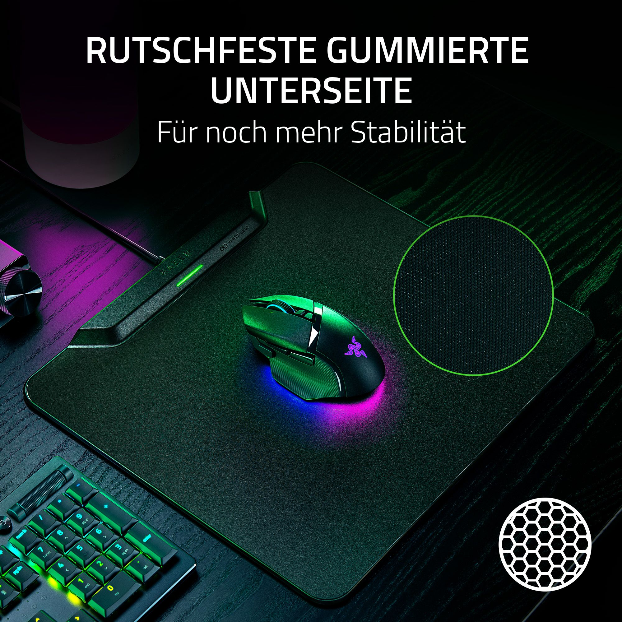 Eine schwarze Maus und ein Pad mit grünen und lila Lichtern. Der Text lautet 'Rutschfeste gummierte Unterseite'.