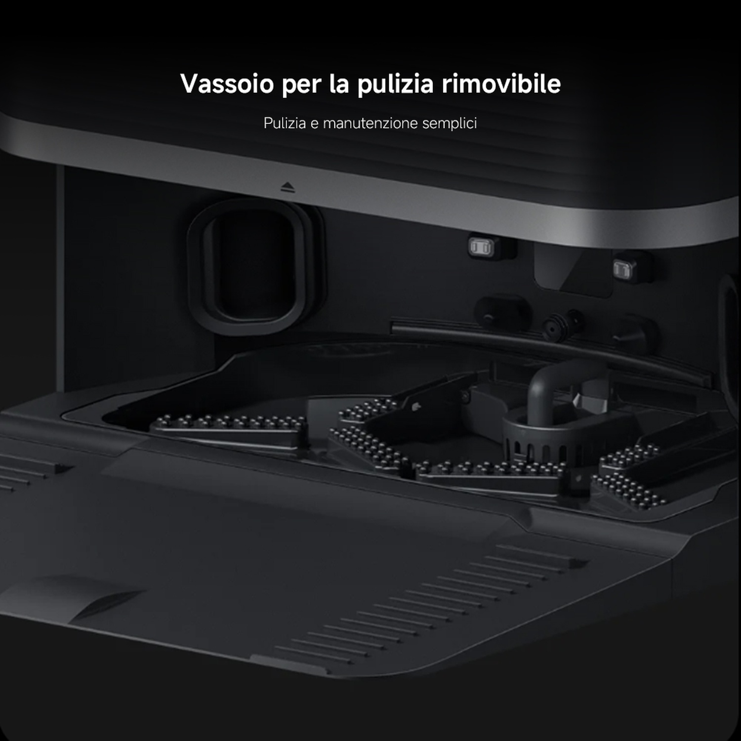 Interno di elettrodomestico nero con vassoio di pulizia rimovibile. Il testo in alto dice 'Vassoio di pulizia rimovibile'.