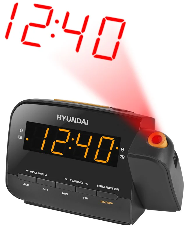 Egy fekete Hyundai ébresztőóra 12:40-et mutat narancssárgán. Egy piros sugár vetíti az időt felfelé. A gombok a hangerő és a hangolás.