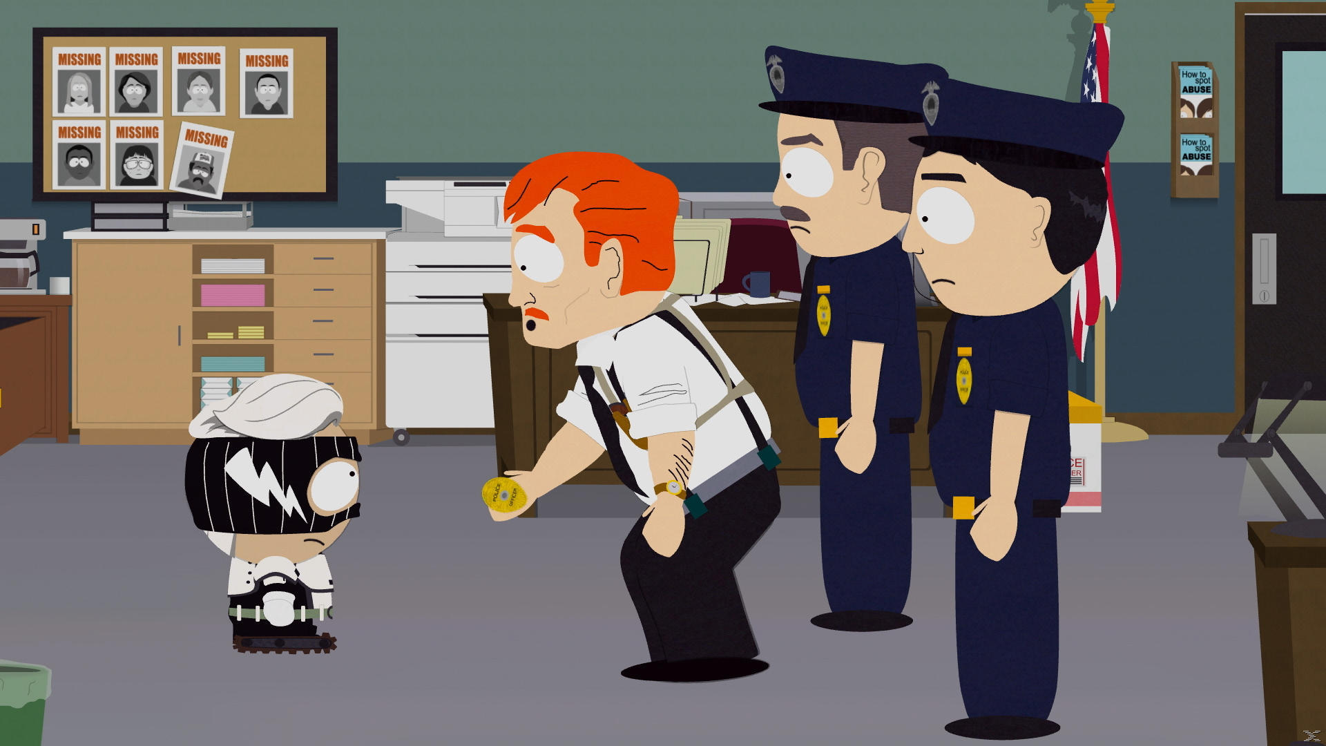 Eine Szene aus South Park. Ein Mann mit roten Haaren und Hosenträgern zeigt einem Polizeibeamten ein Polizeiausweis.