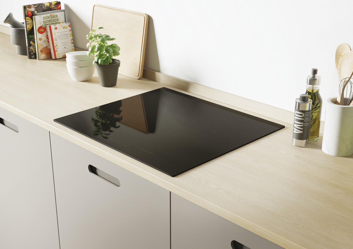 Una encimera de cocina con una placa de cocina negra. Hay libros, una planta y botellas de aceite de oliva en la encimera.