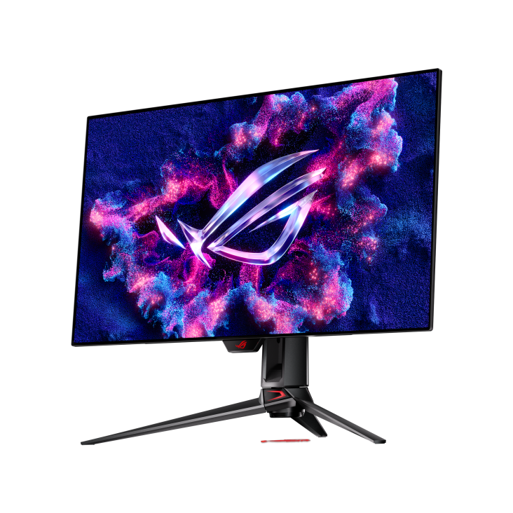 Un monitor gaming muestra una imagen vibrante similar a una nebulosa con el logo ROG. El monitor está sobre un soporte negro con detalles rojos.
