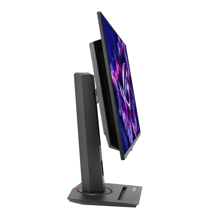 Un monitor de computadora negro sobre un soporte. La pantalla muestra una imagen abstracta colorida. El soporte es gris oscuro.