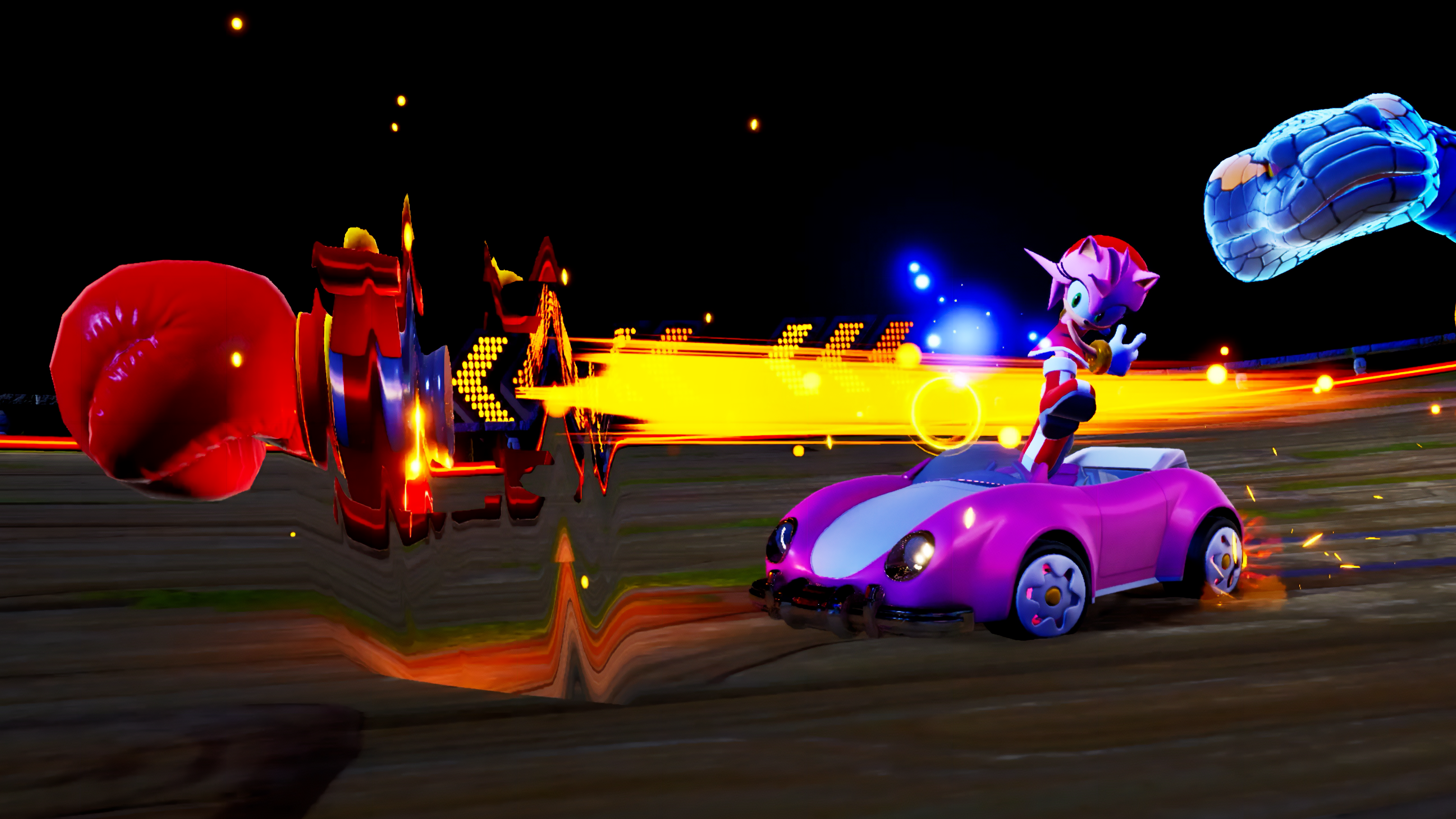 Amy Rose dans une voiture rose en course avec des traînées d'énergie jaunes. Un gant de boxe rouge et un personnage bleu sont dans la scène.
