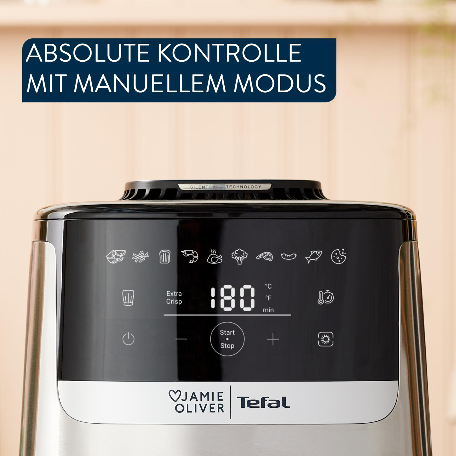 Eine Heißluftfritteuse mit Display. Zeigt Temperatur und Einstellungen. Marken: Jamie Oliver und Tefal.