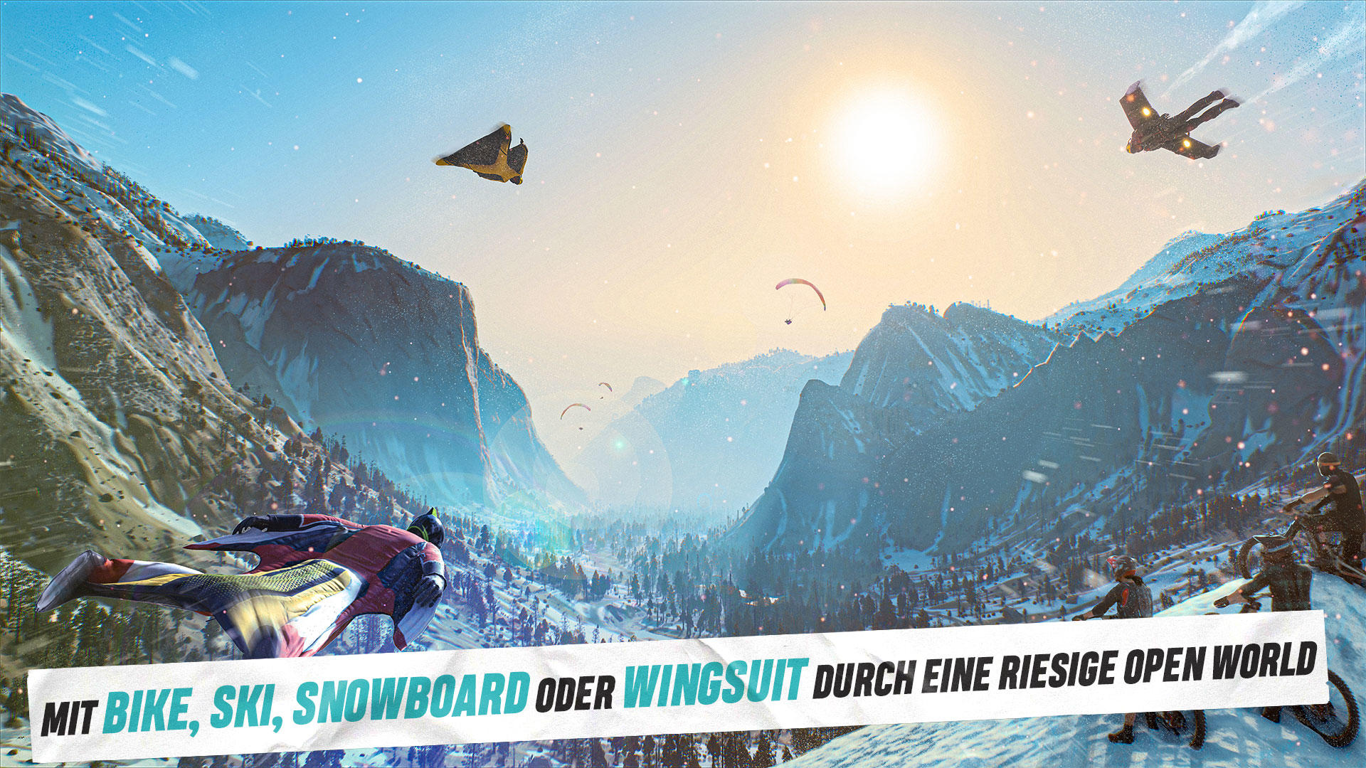 Ein Wingsuit-Flieger schwebt über schneebedeckten Bergen mit anderen. Ein großes Banner lautet 'MIT BIKE, SKI, SNOWBOARD ODER WINGSUIT'.