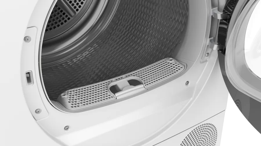 Intérieur d'un sèche-linge, montrant un filtre et le tambour. La porte est ouverte. L'intérieur du sèche-linge est gris métallique.