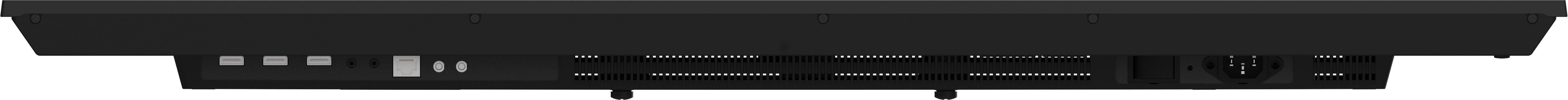 Ansicht von unten eines schwarzen elektronischen Geräts. Anschlüsse, Lüftungsschlitze und Stromeingang sind sichtbar.