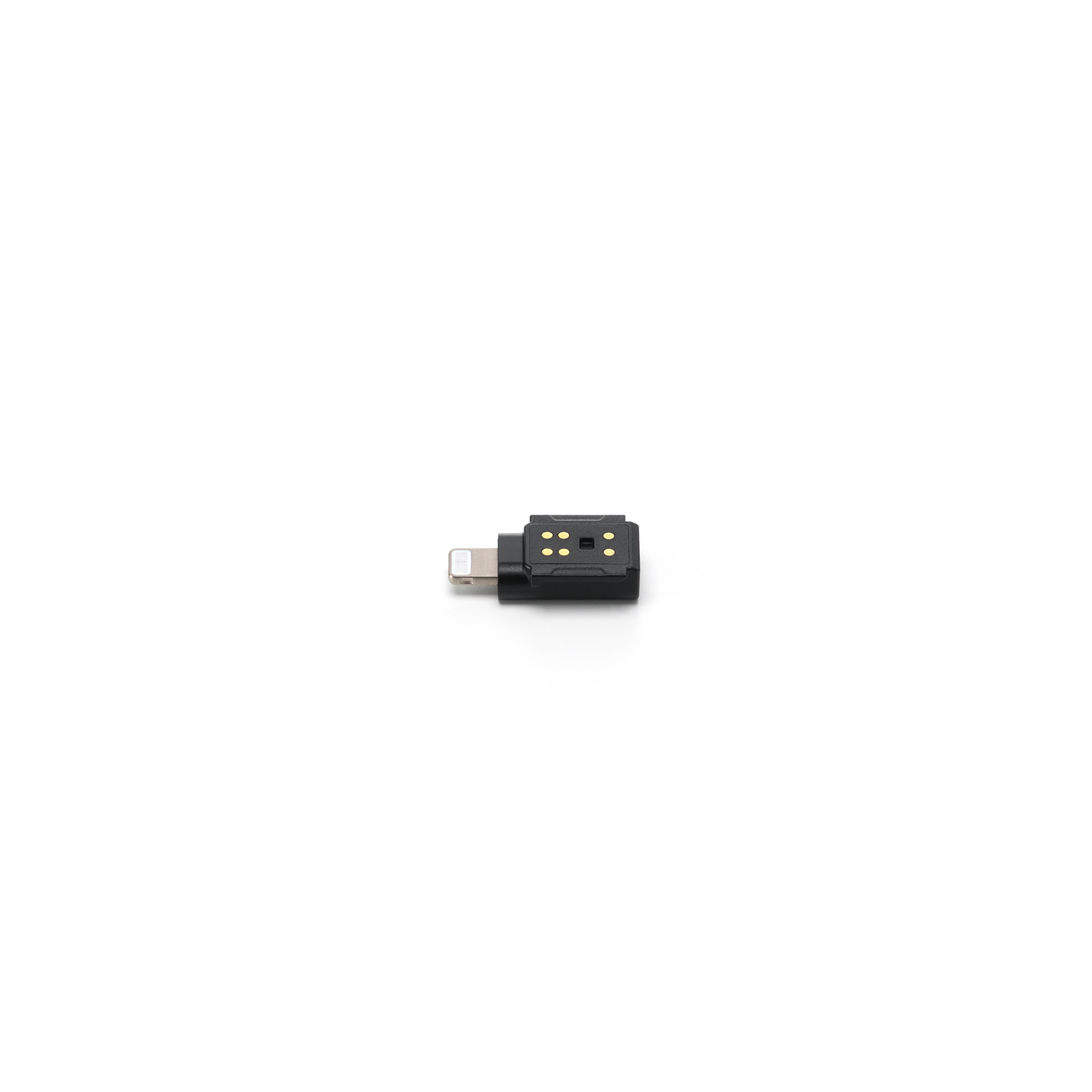 Een zwarte adapter met lightning connector en een vierkante bovenkant met gouden stippen, geïsoleerd op witte achtergrond.