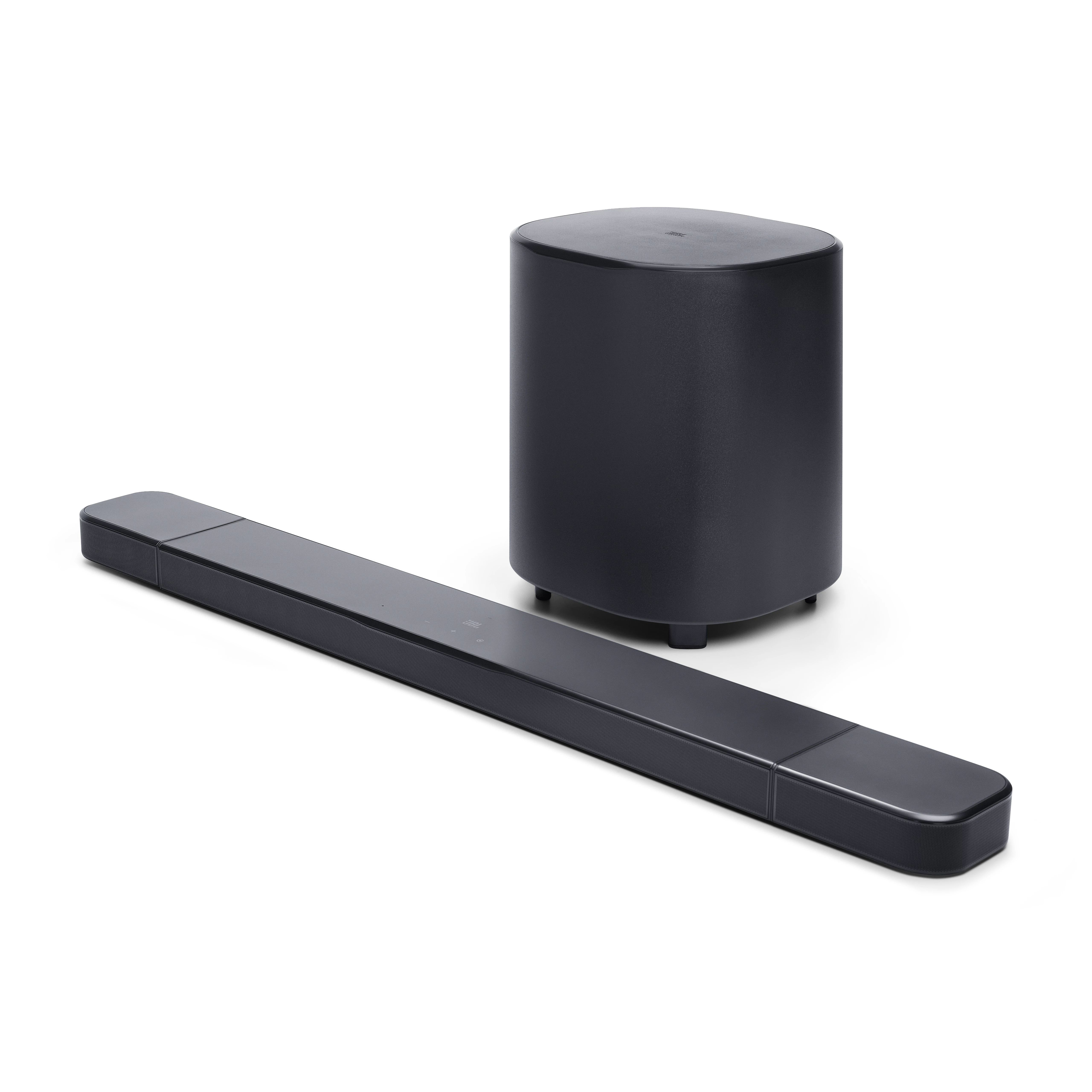 Beyaz zemin üzerinde siyah bir soundbar ve subwoofer. Soundbar uzun, subwoofer silindirik.