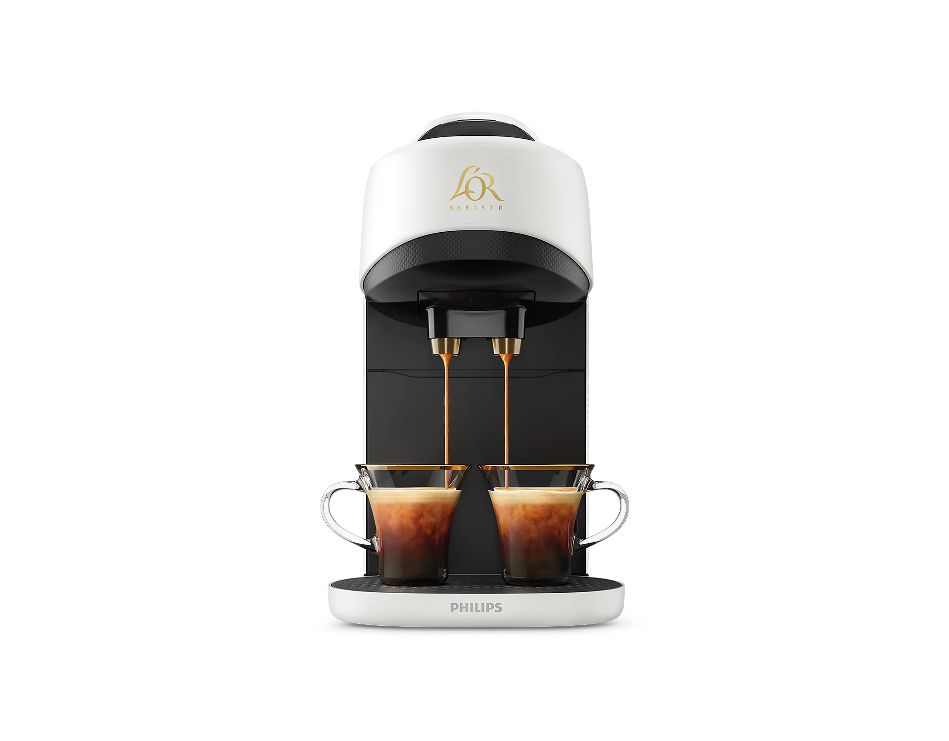 Una cafetera blanca y negra dispensa café en dos tazas de vidrio. La máquina tiene el logotipo 'L'OR Barista'.