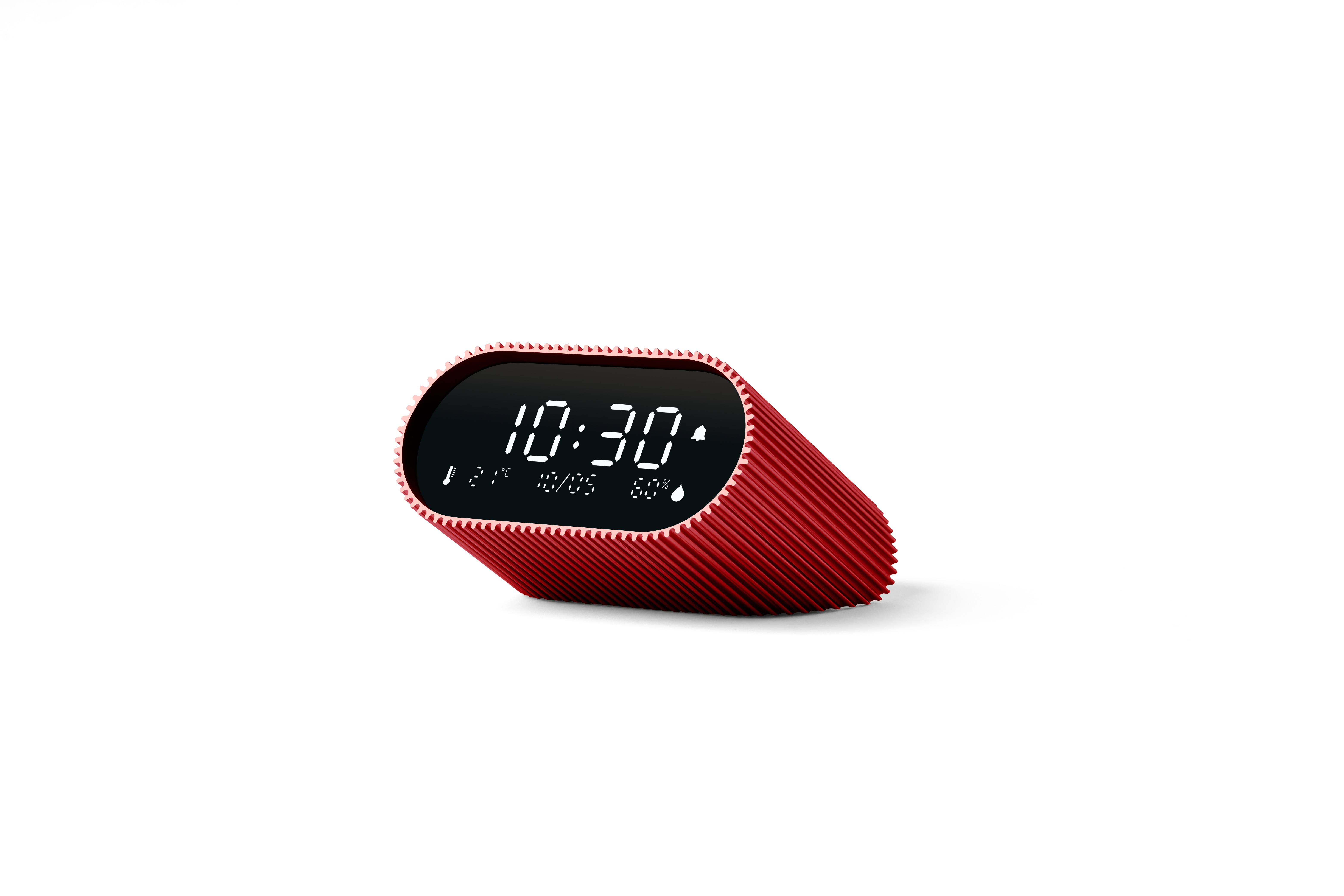 Eine rote Digitaluhr zeigt 10:30 Uhr an. Die Uhr hat eine strukturierte Oberfläche und befindet sich vor weißem Hintergrund.