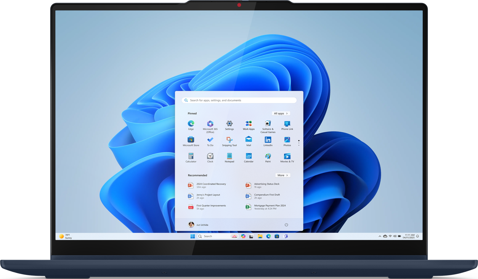 Laptop, der Windows 11 anzeigt, mit einem Popup-Menü für Apps und Einstellungen. Blauer, abstrakter Hintergrund.