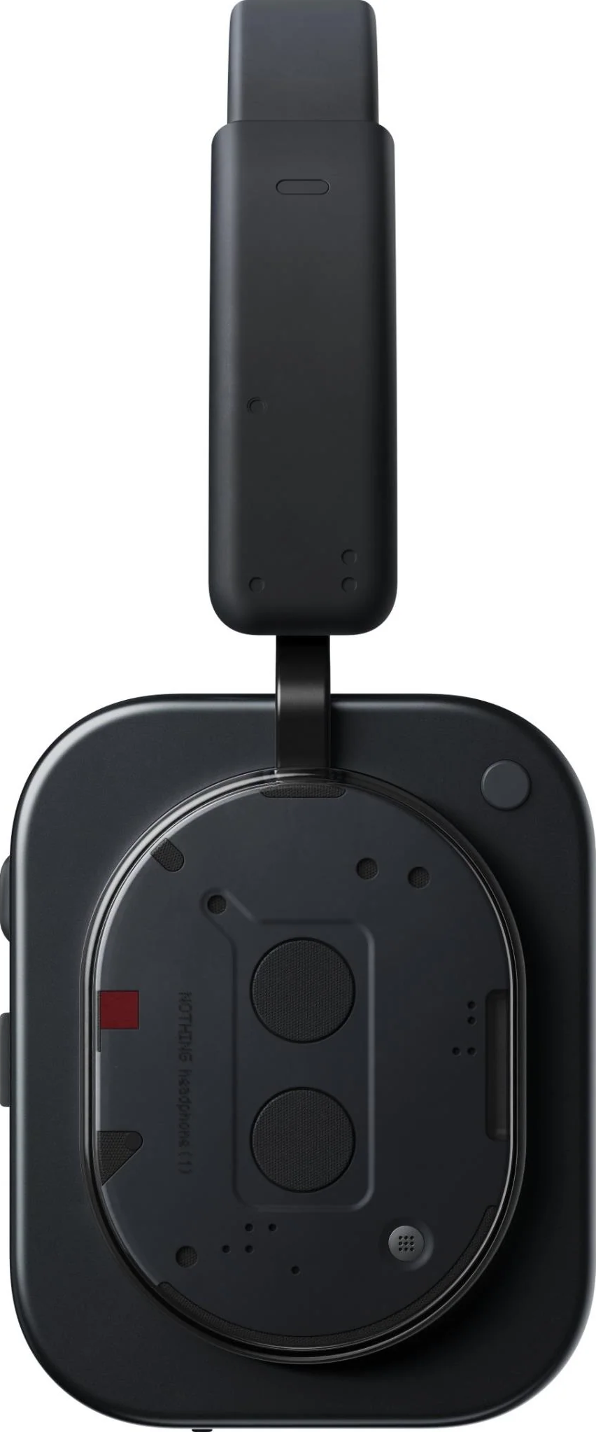 Casque sans fil noir. Vue de dessus montrant le port de charge et le détail de l'écouteur avec haut-parleur et accent rouge.