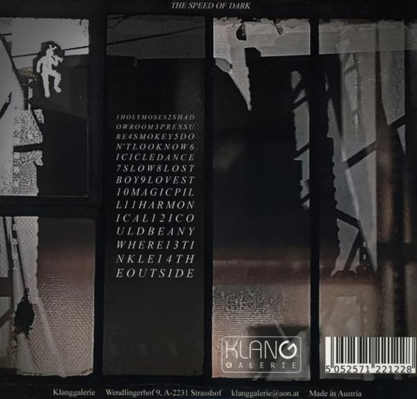 Albumcover mit dem Titel 'The Speed of Dark' und einer Liste von Songtiteln. Unten sind ein Logo und ein Barcode.