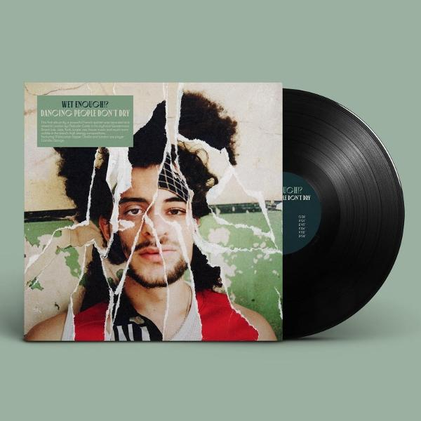 Albumcover mit einem Porträt eines Mannes, das teilweise durch zerrissenes Papier verdeckt ist. Rechts ist eine Schallplatte.