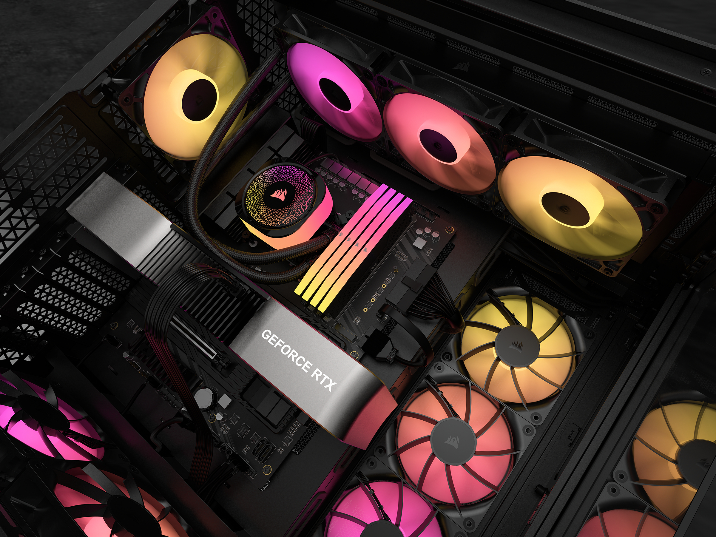 In einem Computergehäuse beleuchten Lüfter mit bunten Lichtern Komponenten wie eine GeForce RTX-Karte und einen Flüssigkeitskühler.