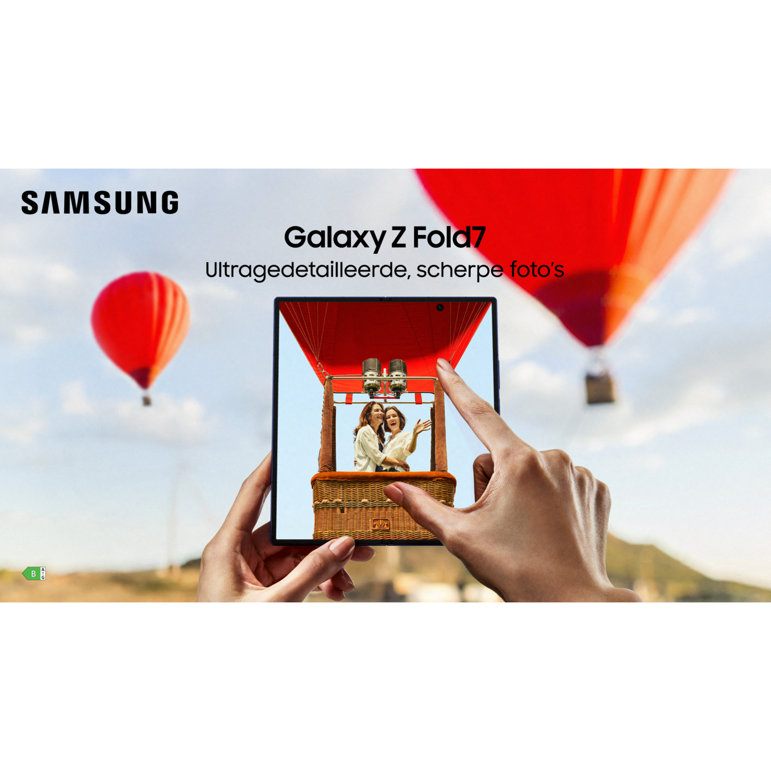A hand holds a Galaxy Z Fold7 showing two women in a hot air balloon. Two other balloons are in the sky.