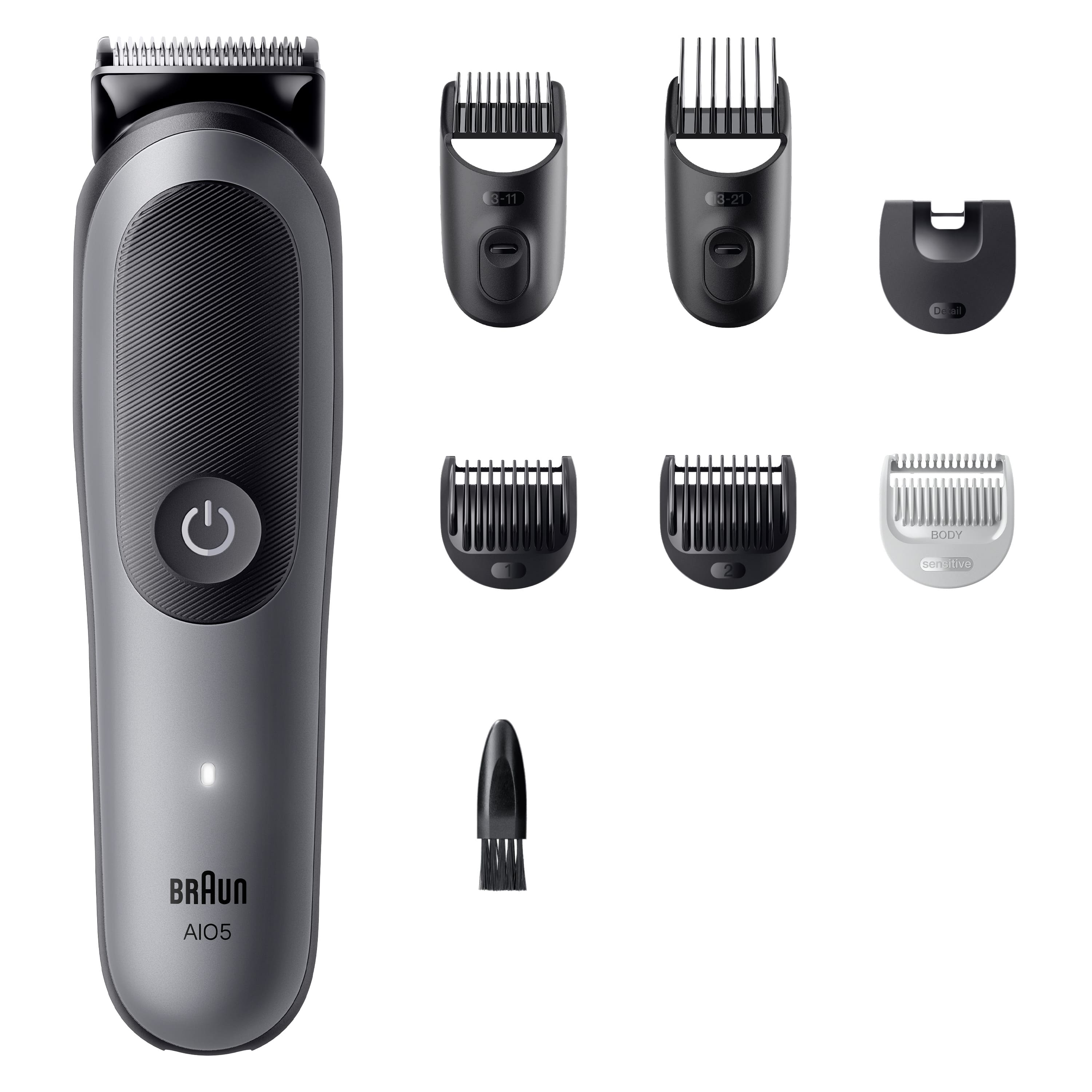 Ekleri olan bir Braun All-in-One düzeltici. Düzeltici, taraklar, fırça ve detaylandırıcı içerir. Gri ve siyah renk şeması.