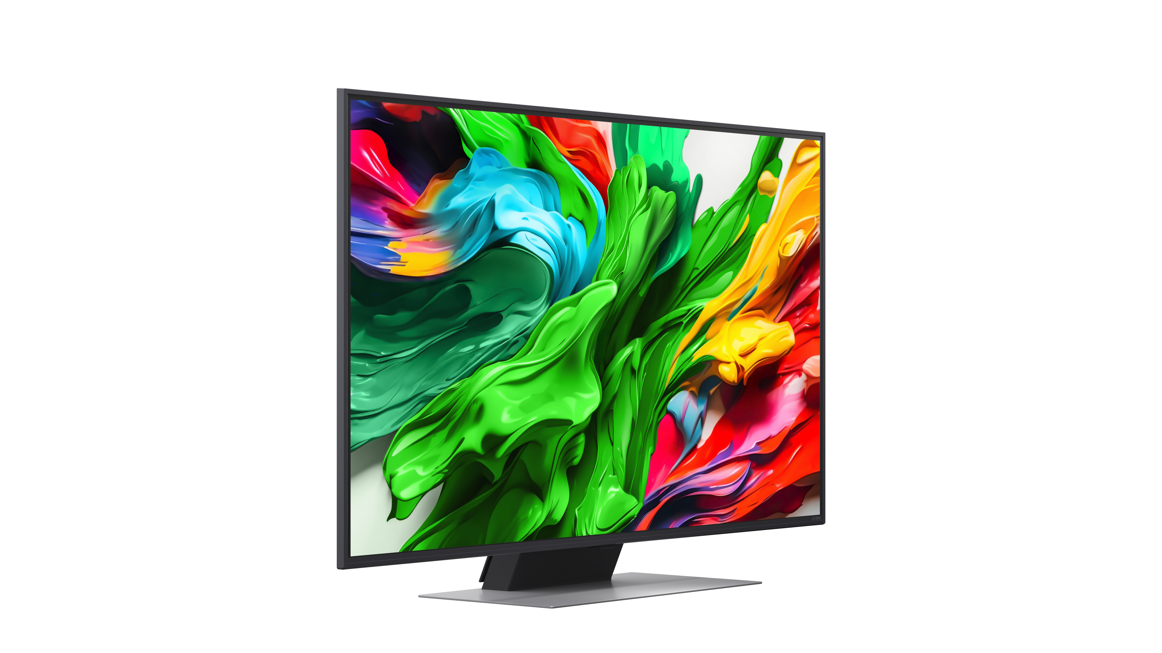 Monitor komputera wyświetla kolorową sztukę abstrakcyjną. Ekran pokazuje zielone, niebieskie, czerwone i żółte wiry na białym tle. Monitor jest czarny.