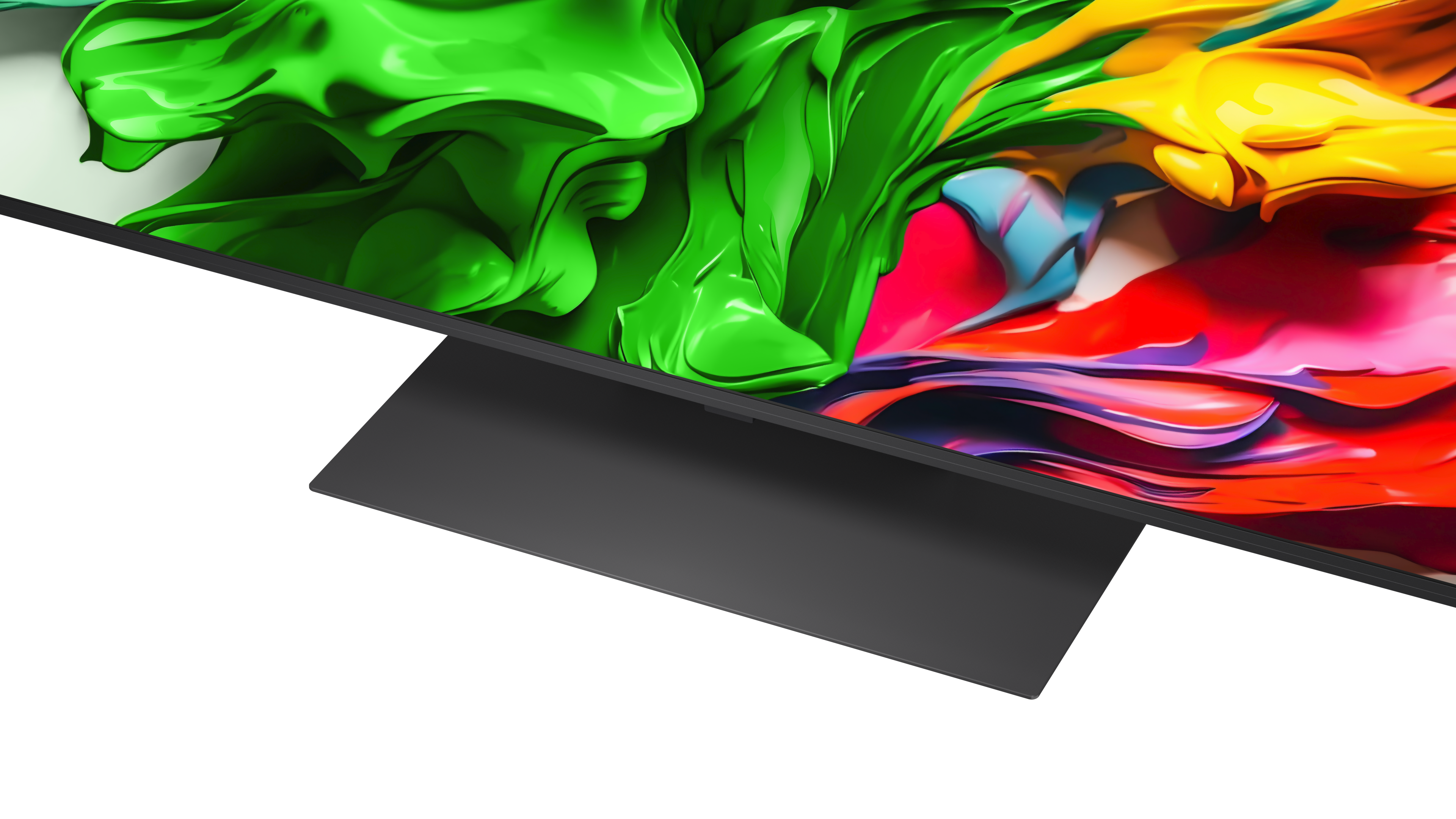 Ekran telewizora wyświetla abstrakcyjne, kolorowe kształty w kolorach zielonym, żółtym i czerwonym. Telewizor ma czarną podstawę.