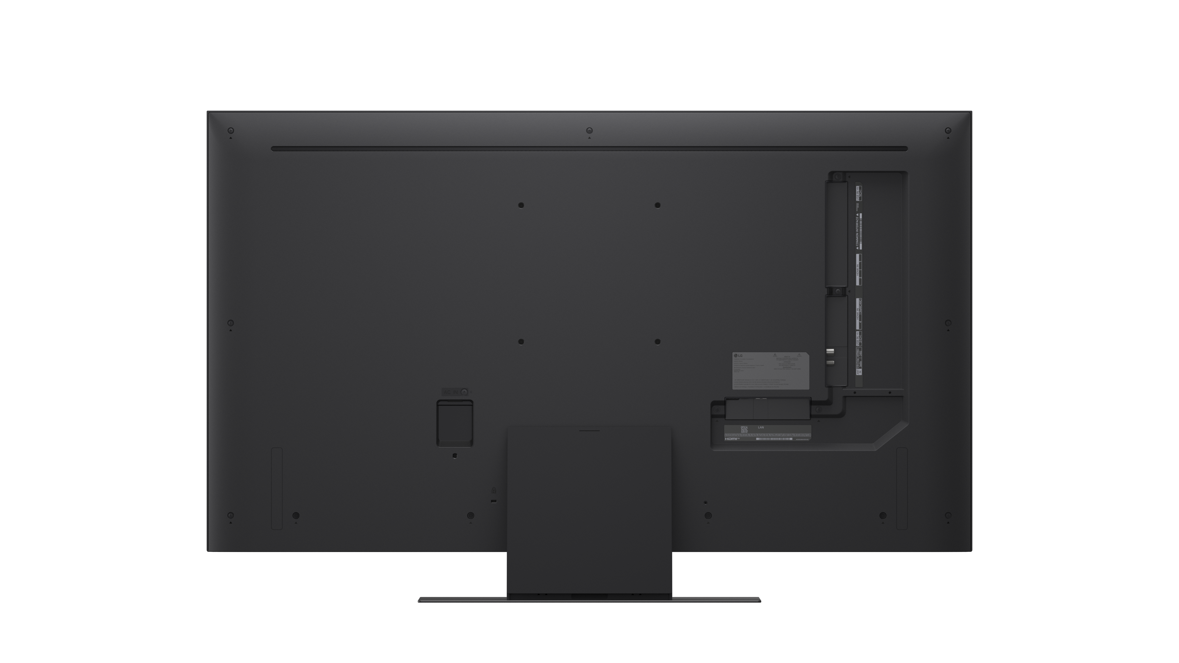 Widzimy tył czarnego telewizora z płaskim ekranem. Ma różne porty, śruby i podstawkę.
