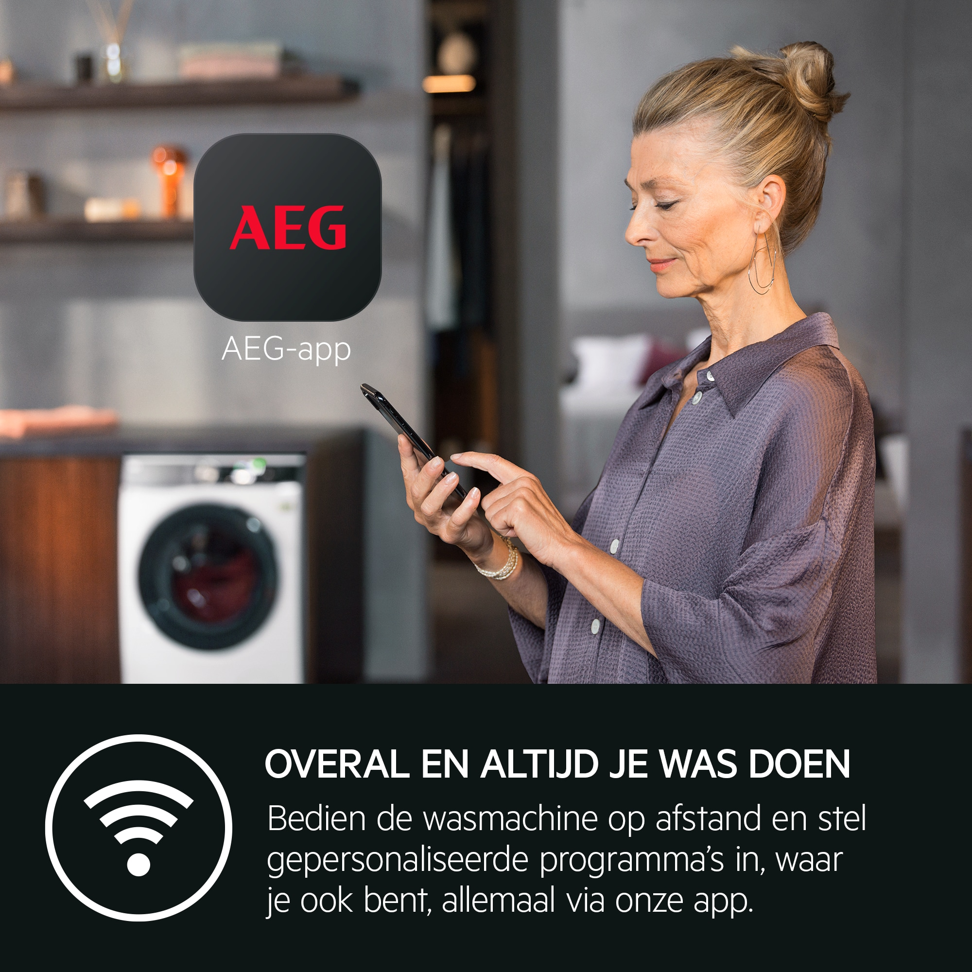 Woman using a phone near a washing machine. An AEG app logo is shown. Text promotes remote laundry control.