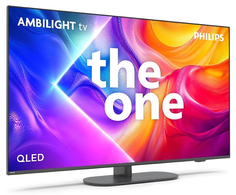 Telewizor Philips Ambilight, the one, wyświetla kolorową sztukę abstrakcyjną. Ma ciemną podstawę. Na ekranie napis QLED.