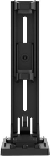 Czarny plastikowy element. Ma prostokątny kształt z pionowymi szczelinami. Małe otwory i centralny okrągły element.