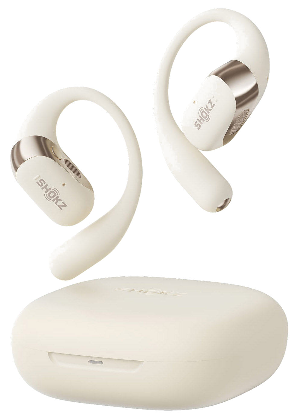 Kremowe słuchawki Shokz z etui ładującym. Słuchawki mają pętlę, metalowe akcenty i logo Shokz.