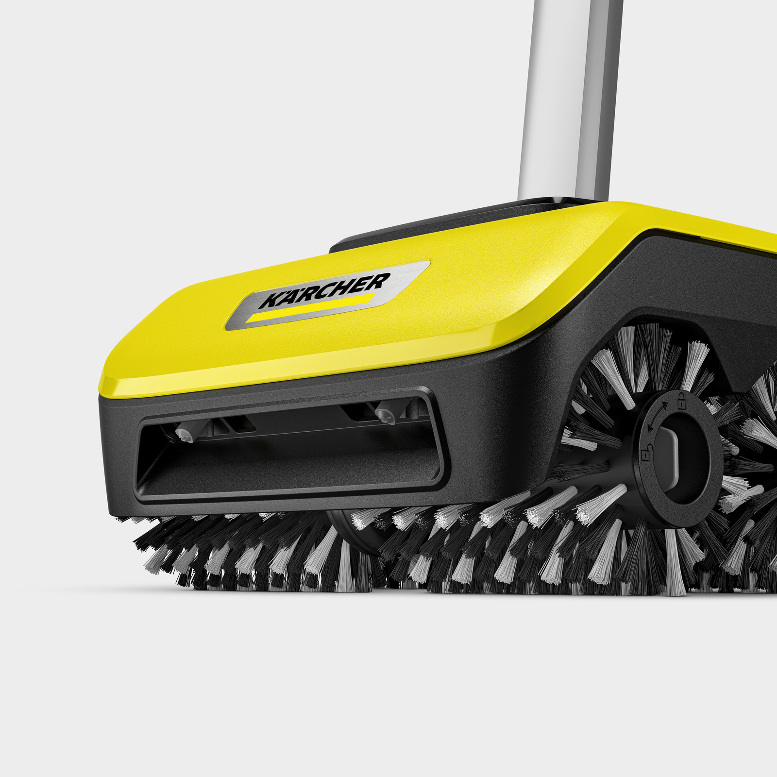 Sárga-fekete Karcher padlótisztító. Forgó kefékkel, fogantyúval és Karcher logóval rendelkezik.