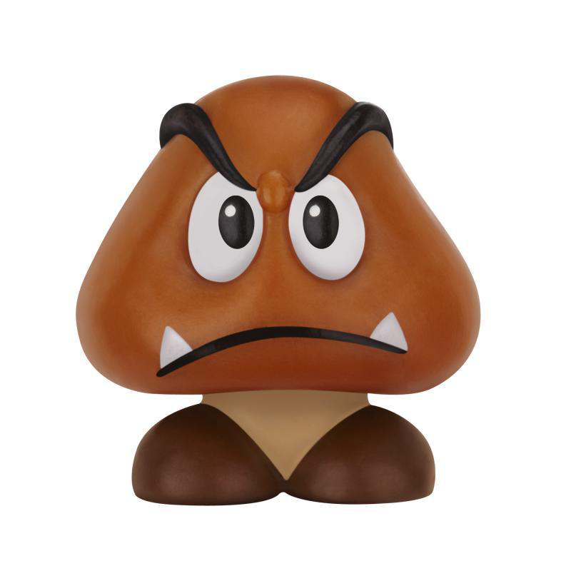 Eine braune Goomba-Figur mit weißen Augen, schwarzen Augenbrauen, einem Stirnrunzeln und zwei kleinen weißen Zähnen. Der Hintergrund ist weiß.