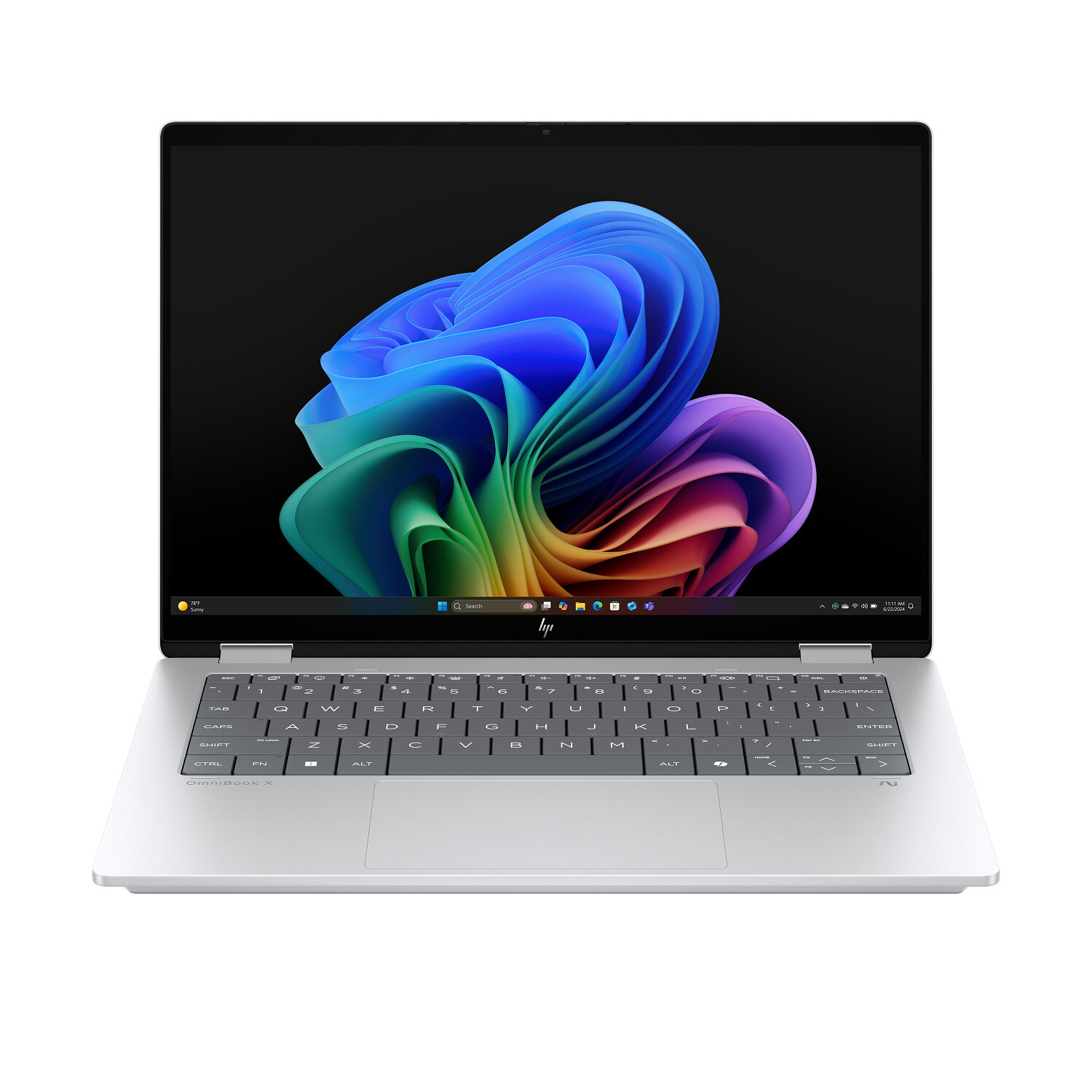 A silver HP laptop is open, displaying a colorful abstract background. The keyboard is visible. Screen shows the Windows 11 interface.