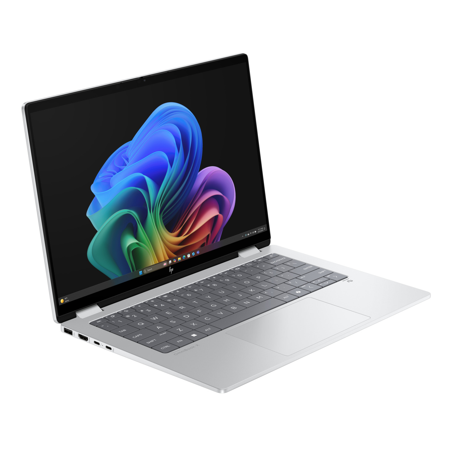 A silver HP laptop is open, displaying a colorful abstract image on its screen. The keyboard is visible.