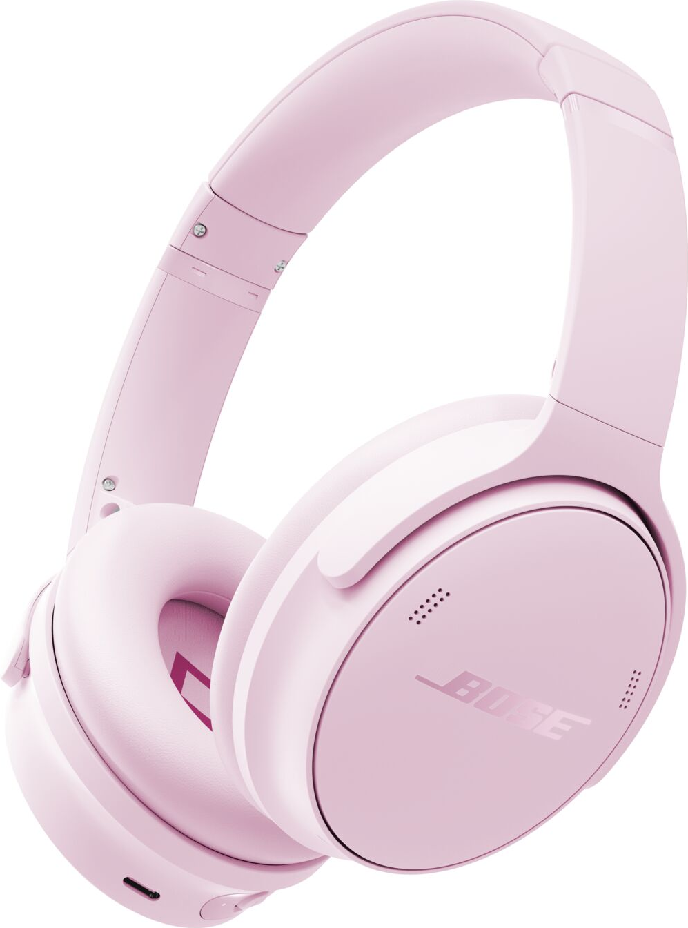 Casque Bose rose sur fond blanc. Le casque est de type circum-auriculaire.