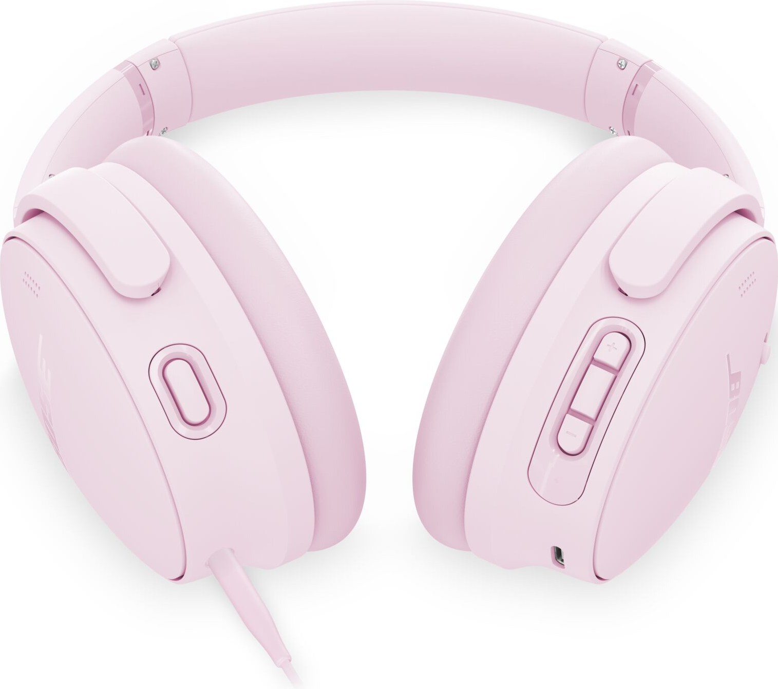 Casque rose sur fond blanc. Ils ont des écouteurs, un bandeau et un panneau de commande avec des boutons. Un câble est attaché.