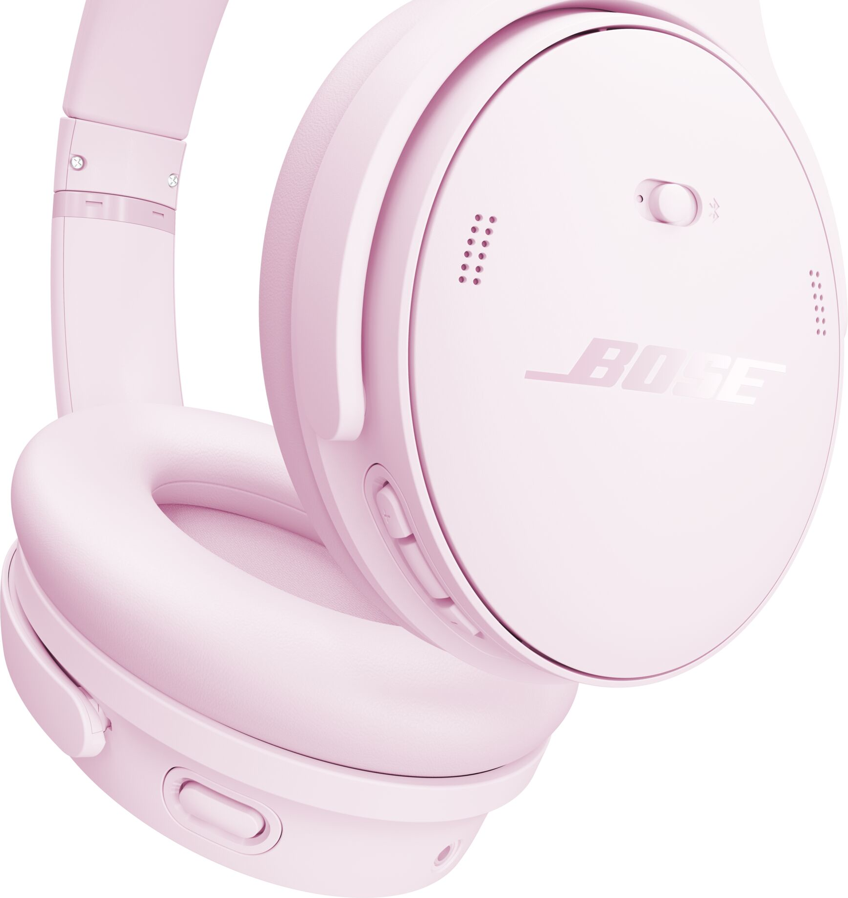 Casque Bose rose. Les oreillettes et le bandeau sont visibles. Le logo Bose est sur l'oreillette. Le casque est sur fond blanc.