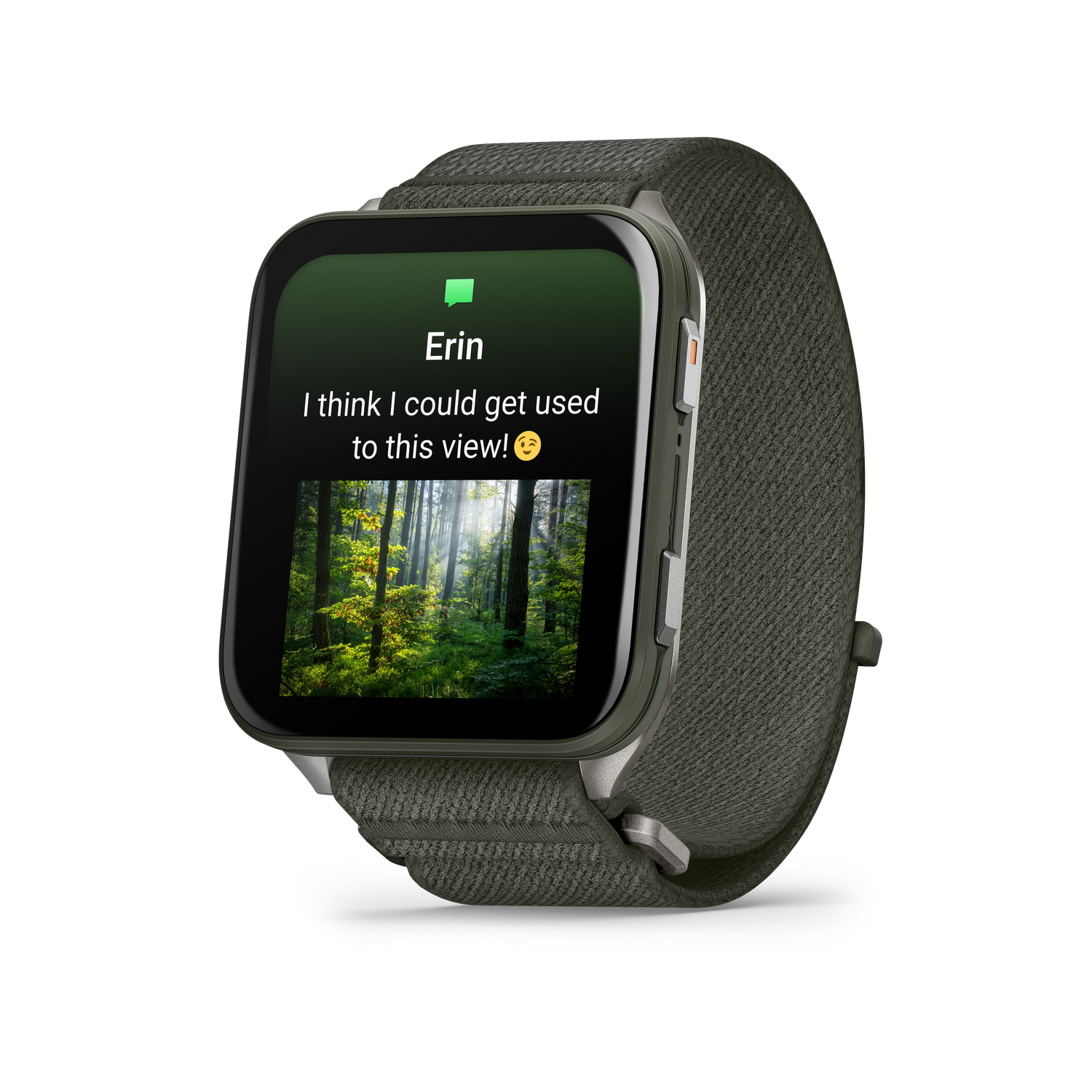 Un reloj inteligente muestra una imagen de bosque con el texto "Erin. ¡Creo que podría acostumbrarme a esta vista!" sobre un fondo verde.