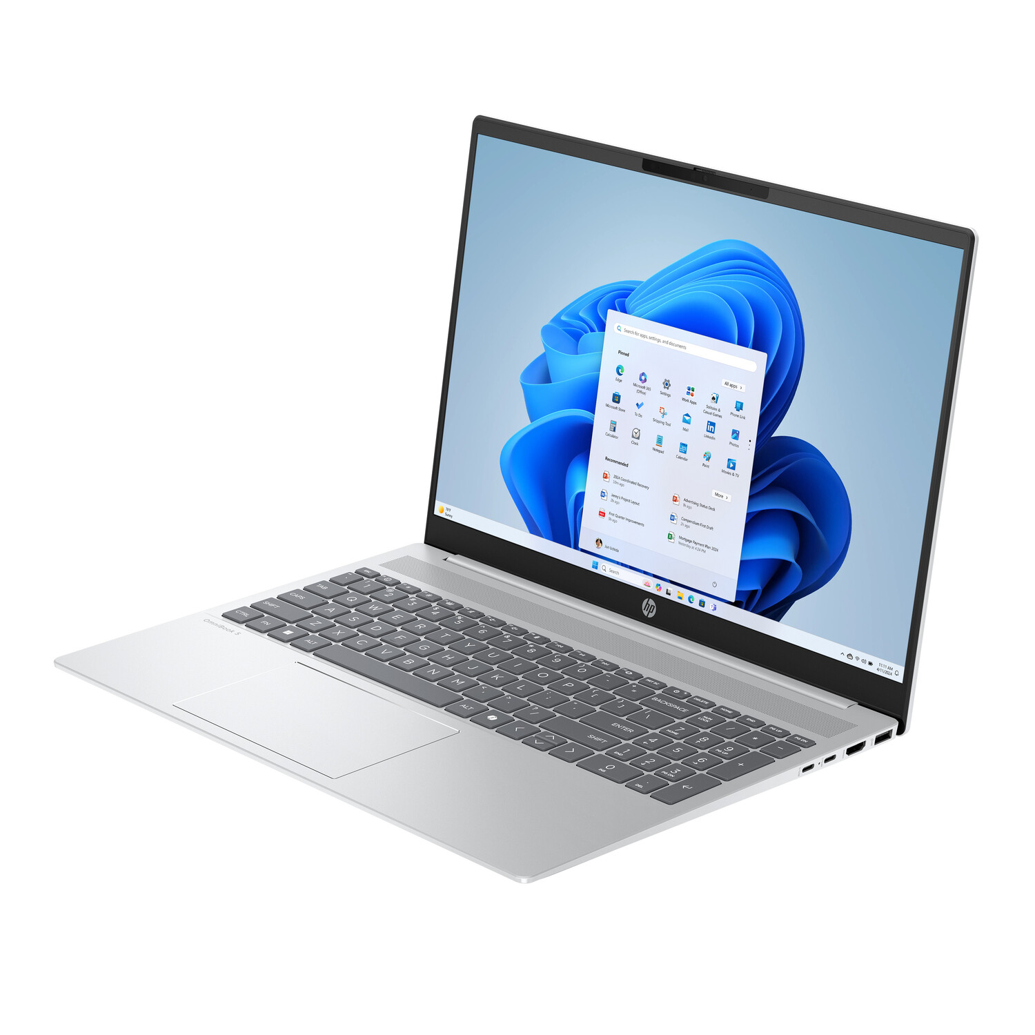 Silver HP laptop open, displaying Windows 11 interface. Keyboard visible, touchpad below. Screen shows app icons and a blue background.