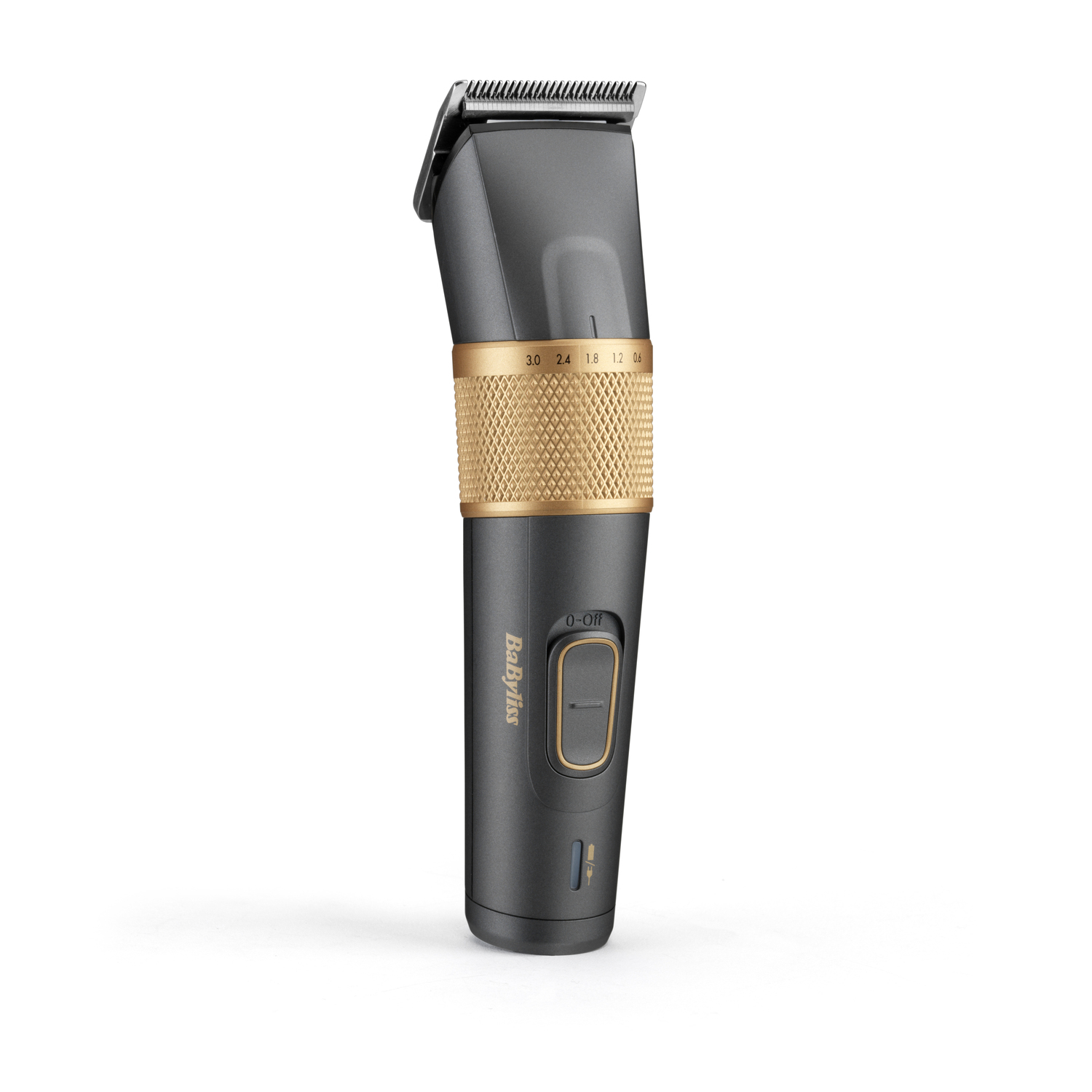 A black and gold Babyliss hair clipper stands upright. It has a gold band, a power button, and settings displayed.