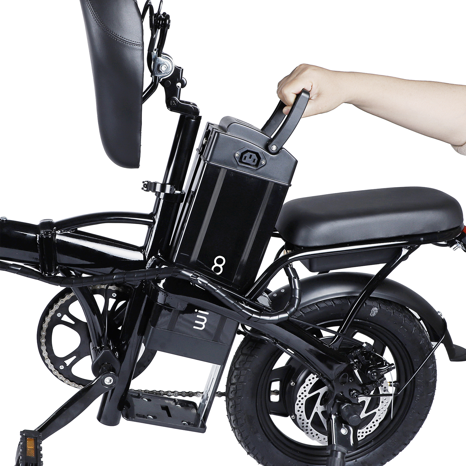 Black electric bike with a person's hand on the battery. The bike is on a white background. The bike has a black seat and wheels.