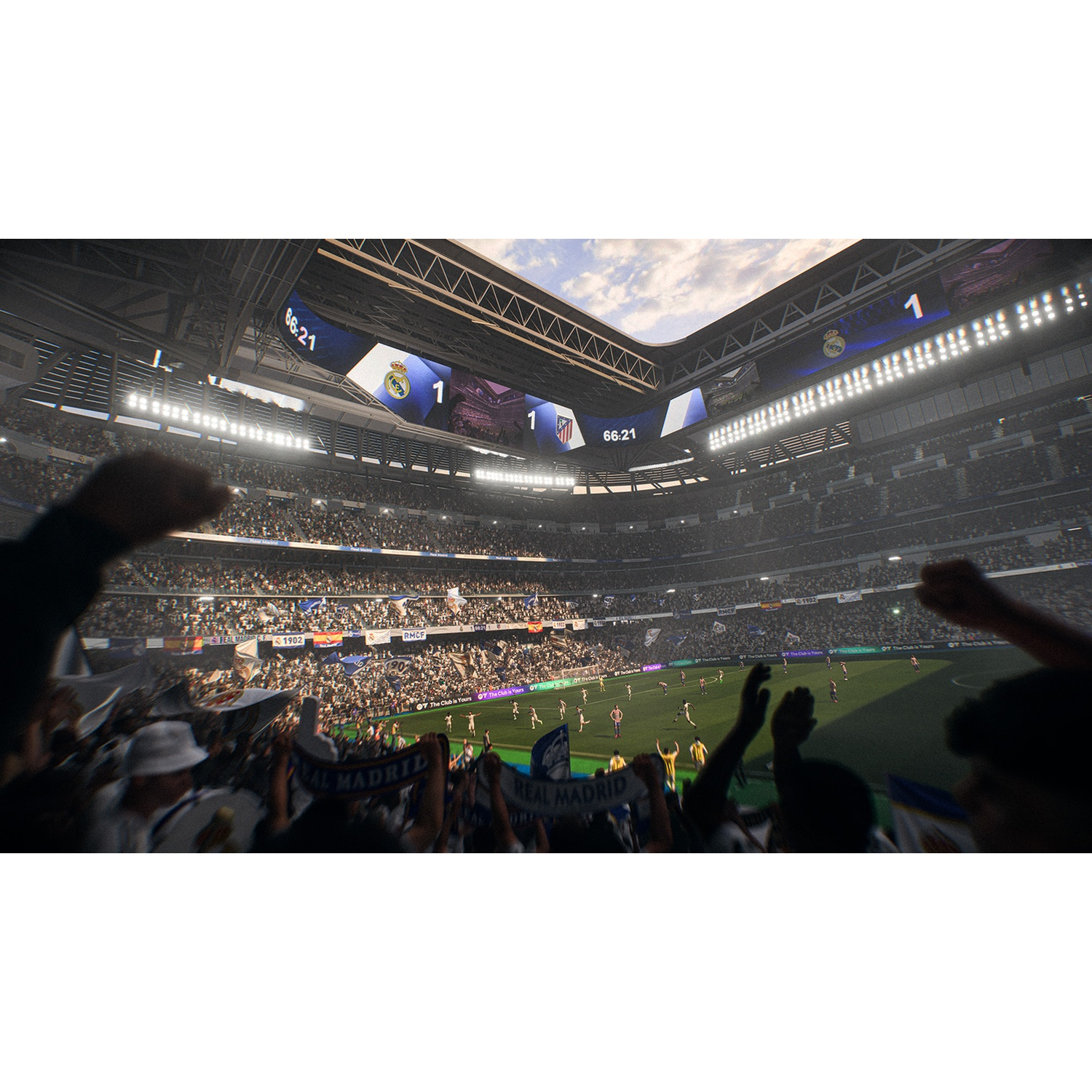 Stadio di calcio pieno di tifosi. Il Real Madrid è in vantaggio 1-0. Giocatori in campo. Il tabellone segna il tempo. I tifosi tifano.