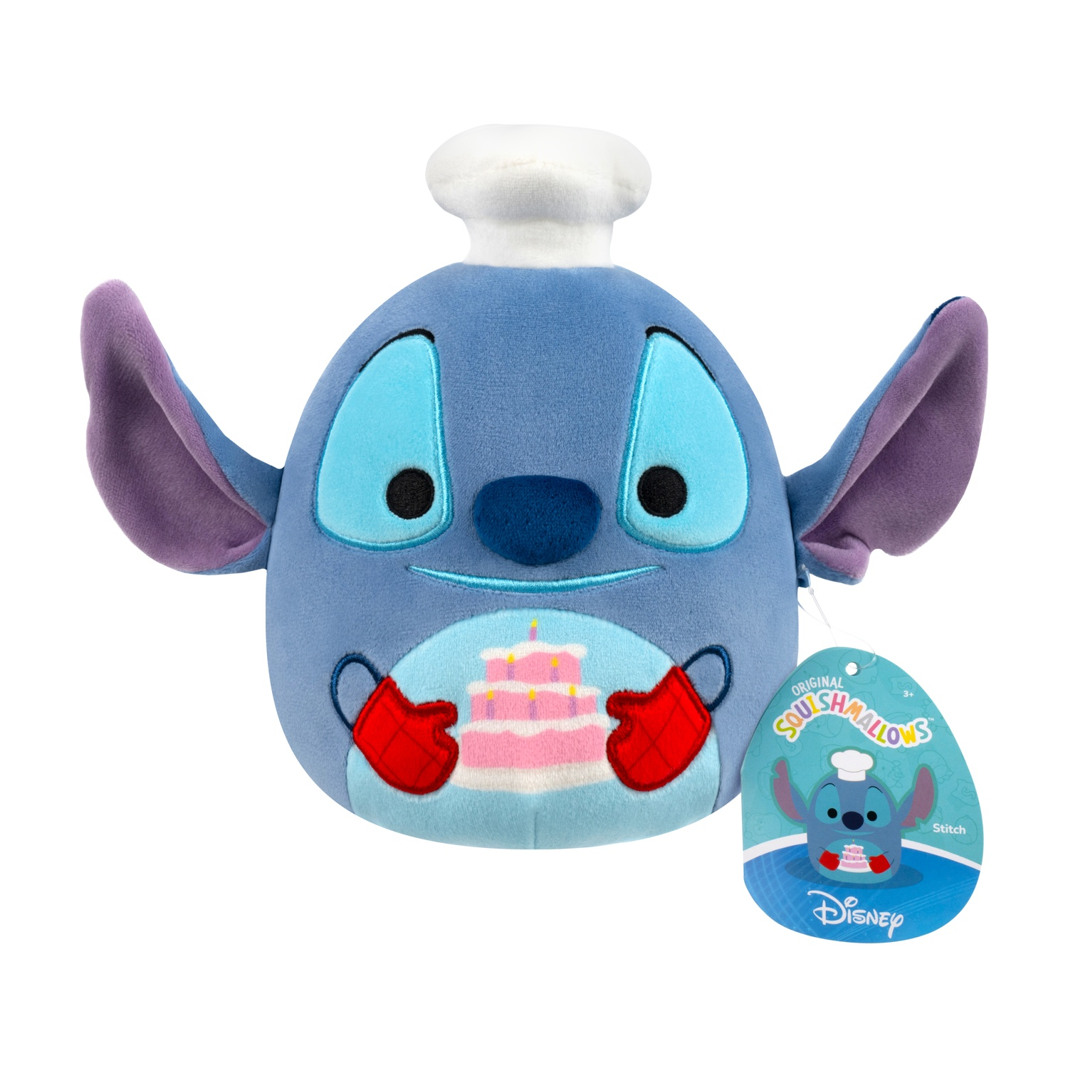 Un peluche blu di Stitch con cappello da chef e torta, con un'etichetta con scritto 'Disney'.
