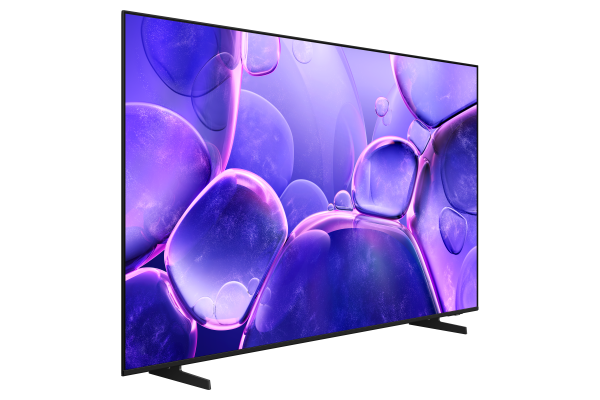 Modern bir TV, koyu bir arka plan üzerinde soyut mor kabarcıklar görüntülüyor. Siyah bir stand üzerinde, yana doğru açılı duruyor.